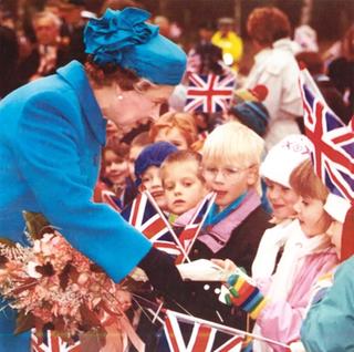 Queen Elisabeth II greets children from the Kindergarten, November 1990.